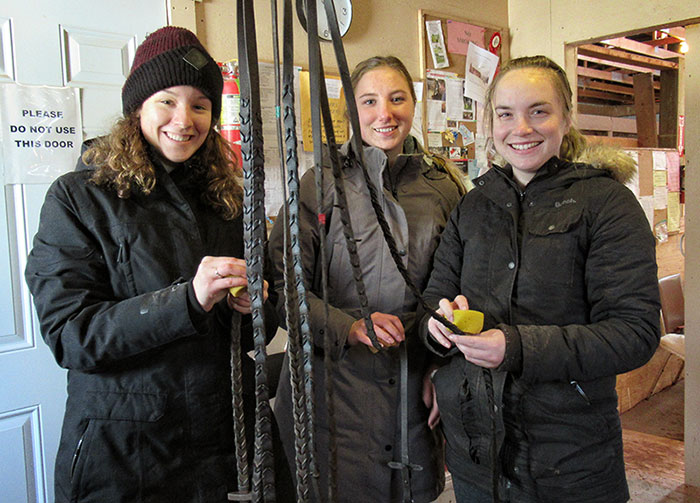Holly Maria and Zoe cleaning tack, Joyriders